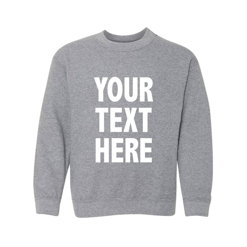 May include: A gray sweatshirt with the text "YOUR TEXT HERE" printed in white on the front.