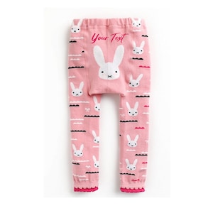 May include: Pink leggings with a white bunny rabbit pattern and the text "Your Text" on the back.