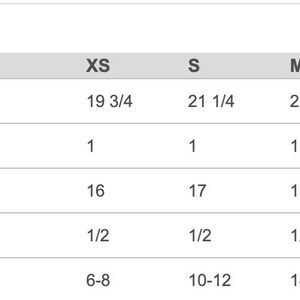 May include: Chart showing finished measurements for a garment in inches. The chart includes sizes XS, S, M, L, and XL, with corresponding measurements for body length, body length tolerance, body width, body width tolerance, and US sizes.