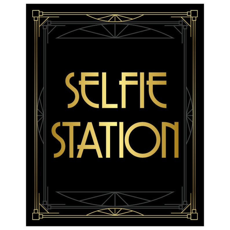 May include: A black and gold art deco style sign with the text "SELFIE STATION" in gold lettering.