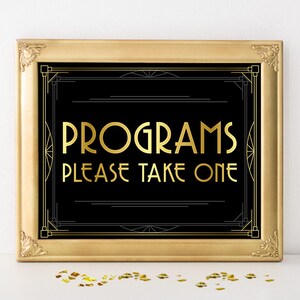 Puede incluir: Un cartel con marco dorado, fondo negro y letras doradas que dice "Programs Please Take One" en estilo art déco.