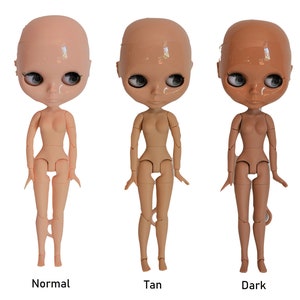 May include: Five nude dolls with different skin tones, ranging from white to super dark. The dolls are all standing with their arms by their sides and their legs slightly apart. The dolls are all bald and have large, round eyes.