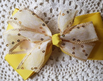 Handmade hair bow in yellow and white