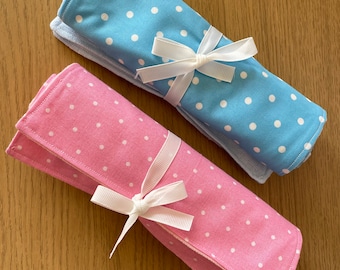 A pair of Polka Dot Burping Cloths