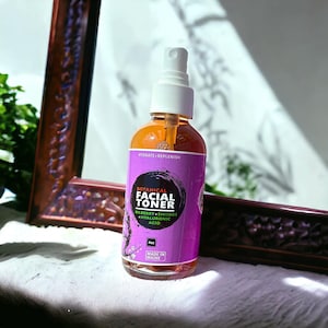 May include: A 4 oz bottle of botanical facial toner with a purple label that says "Botanical Facial Toner" and "Bilberry + Shiitake + Hyaluronic Acid". The bottle is made in Maine.