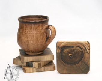 Set of 4 wooden coasters. Slices made of walnut wood. Wooden slice