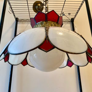 May include: A set of three ceramic mugs with a speckled, matte finish. The mugs are in shades of cream, light gray, and dark gray. Each mug has a simple, minimalist design and a rounded handle.