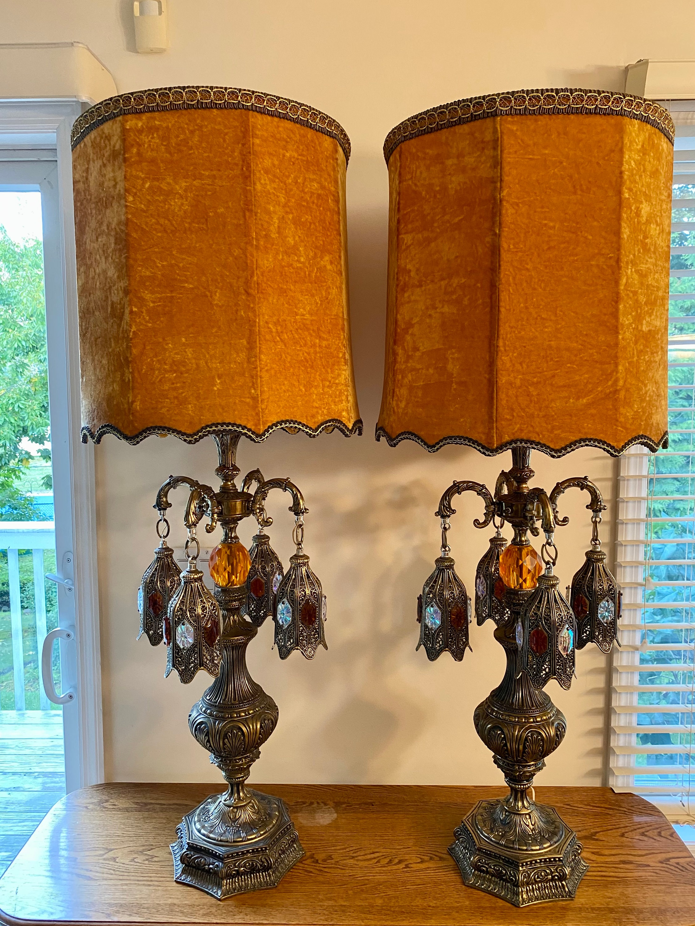 Pair of Loevsky & Loevsky Amber Lucite and Brass Hollywood Regency