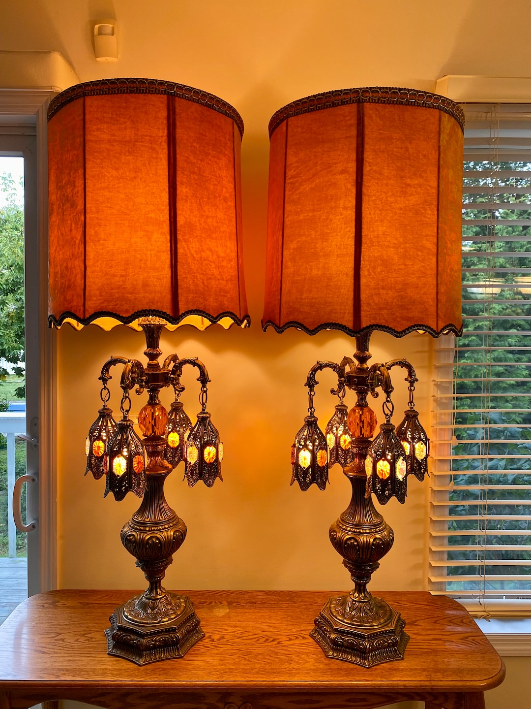 Pair of Loevsky & Loevsky Amber Lucite and Brass Hollywood Regency