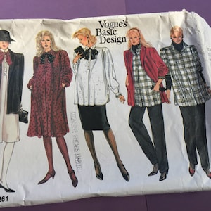 May include: Vogue's Basic Design sewing pattern 1261. The pattern features illustrations of women's fashion designs, including a blazer, dress, and blouses. The designs are in various colors and patterns, including polka dots and plaid.