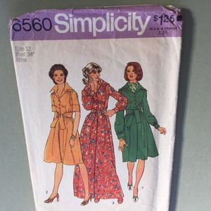 May include: Vintage Simplicity sewing pattern with three dress designs. The pattern shows illustrations of dresses in orange, floral red, and green. The pattern is labelled "6560" and includes size 12, bust 86 cm.