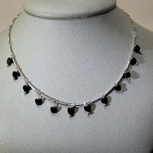 May include: A rustic wooden sign with the text "Welcome to our home" in white lettering. The sign has a distressed finish and a simple, inviting design, suitable for a front porch or entryway.