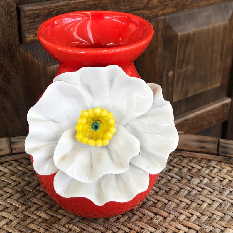 May include: A set of three ceramic mugs with a speckled, matte finish. The mugs are in shades of cream, light gray, and dark gray. Each mug has a simple, minimalist design, perfect for coffee or tea.