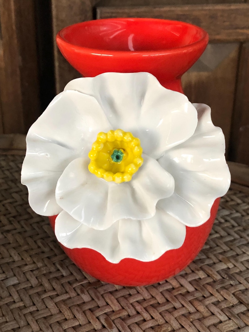 May include: A set of three ceramic mugs with a speckled, matte finish. The mugs are in shades of cream, light gray, and dark gray. Each mug has a simple, minimalist design, perfect for coffee or tea.