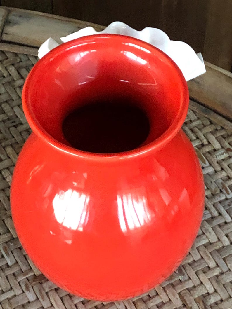 May include: A set of three ceramic mugs with a speckled, matte finish. The mugs are in shades of cream, light gray, and dark gray. Each mug has a simple, minimalist design and a rounded handle.