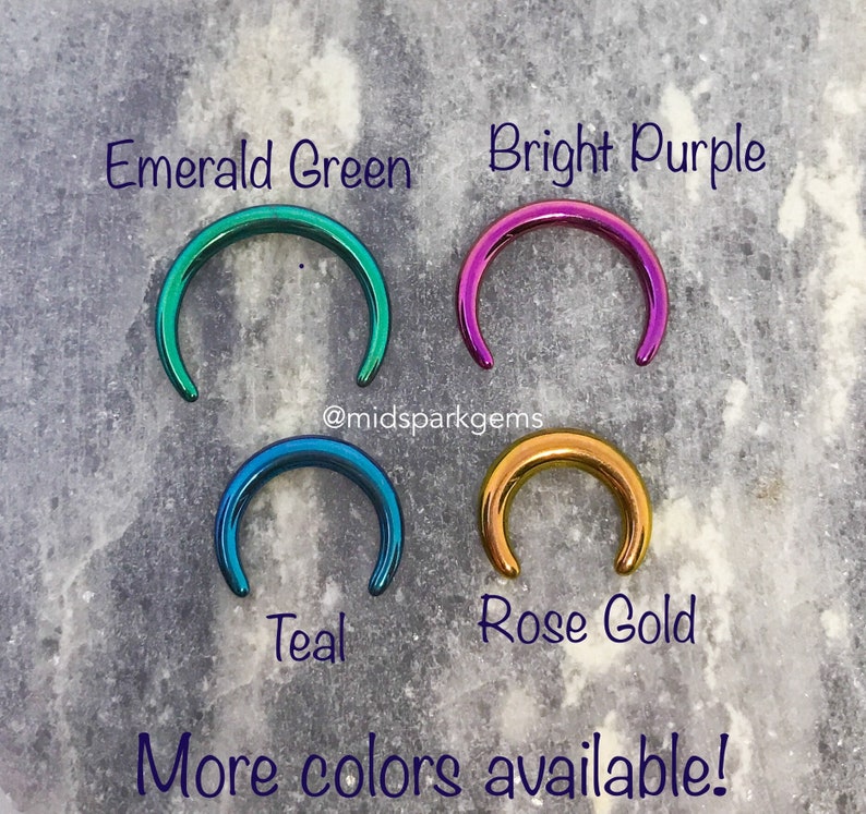 May include: Four different colored metal rings, in emerald green, bright purple, teal, and rose gold. The rings are all the same size and shape, and they are arranged in a square pattern. The text "@midsparkgems" is written below the rings. The text "More colors available!" is written below the text "@midsparkgems".