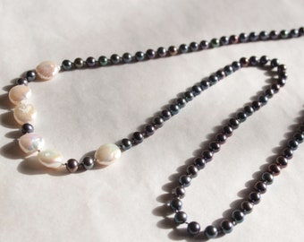 Long knotted dark grey round and white coin pearl necklace