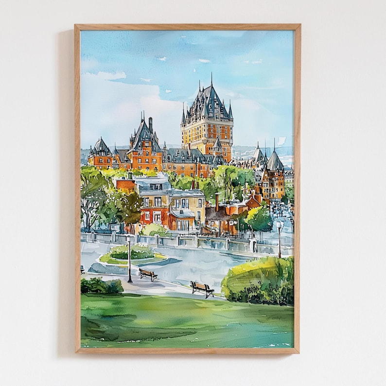May include: Watercolor painting of a cityscape featuring a large, ornate building with multiple towers and a complex roofline. The buildings are primarily orange and brown, set against a blue sky. The artwork is framed in a light-colored wooden frame.