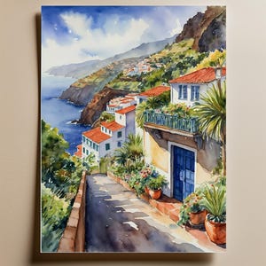 May include: A watercolor painting of a narrow, winding street in a coastal town. The street is lined with white houses with red tile roofs and lush green plants. The houses are built into a hillside overlooking the ocean. The sky is blue with white clouds.