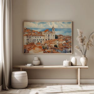 Lisbon_Alfama_watercolor_painting_on_the_wall_of_a_minimalistic_interior_with_light_above_a_console_table
