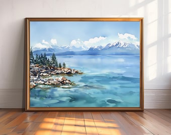May include: Watercolor painting of a serene lake scene with snow-capped mountains in the background. The artwork features a shoreline with trees and rocks, framed in a gold-colored wooden frame. The water is a mix of blues and greens.