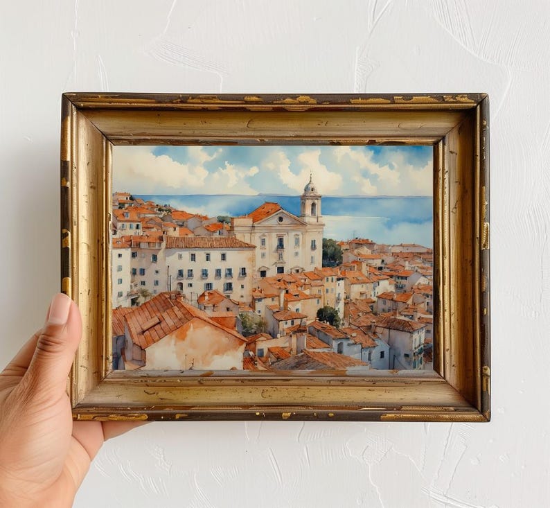 Lisbon_Alfama_watercolor_painting_placed_inside_an_antique_wooden_frame_with_gold_accents_on_the_edges