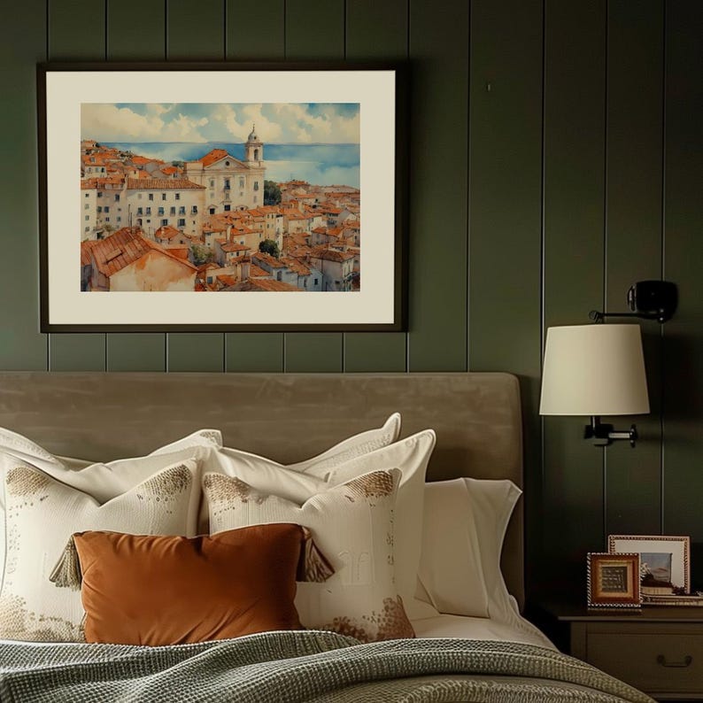 Lisbon_Alfama_watercolor_painting_hangs_above_an_antique_beige_velvet_bed_with_brown_and_white_pillows