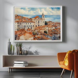 Lisbon_Alfama_watercolor_painting_hanging_on_the_wall_above_an_elegant_console_table_with_vases_and_books