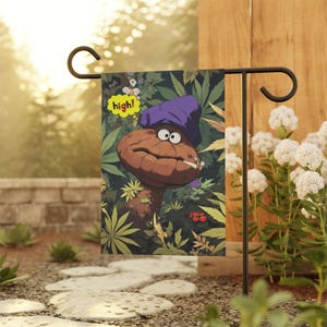 May include: A garden flag featuring a cartoon mushroom character with a purple hat and a lit cigarette. The mushroom is surrounded by cannabis leaves, with the word "high!" in a speech bubble. The flag is displayed on a black metal stand.