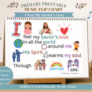 Puede incluir: Un rotafolio de música encuadernado en espiral titulado Primary Printable Music Flip Chart I Feel My Savior's Love. La página presenta ilustraciones coloridas que incluyen un globo terráqueo, un corazón, un arcoíris y niños, junto con la letra I feel my Savior's love in all the world around me, His Spirit warms my soul through everything I see.