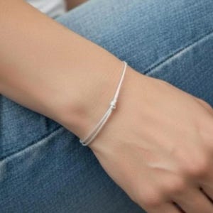 Silver cord bracelet. Minimalist lucky charm bracelet to stack. Chic and trendy.
