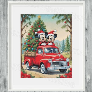 May include: A framed print featuring Mickey and Minnie Mouse in Santa hats atop a red vintage truck. A decorated Christmas tree is in the truck bed. The background shows a winter landscape with trees and a light blue sky.