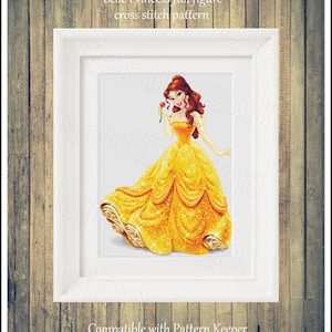 May include: A cross stitch pattern featuring Belle, the Disney princess, in her iconic yellow gown. She is holding a red rose and has a sparkling, golden dress. The pattern is compatible with Pattern Keeper.
