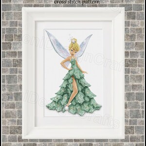 May include: Cross stitch pattern of Tinkerbell wearing a green dress with a white bodice and sparkling wings. The pattern is compatible with Pattern Keeper.