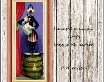 Puede incluir: Patrón de punto de cruz para un diseño de temática Haunted Mansion con Goofy de pie sobre un barril etiquetado como "Danger Dynamite".