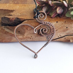 Oxidised copper wire wrapped heart and spiral pendant