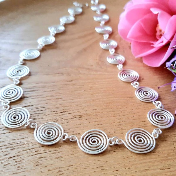 Silver Spiral Necklaces in a Celtic style