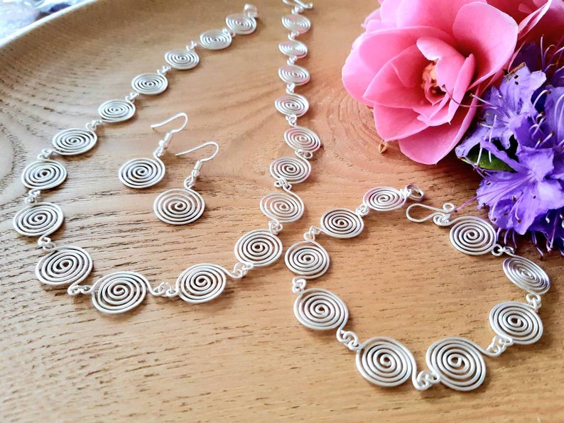 Silver spiral necklace, bracelet and earrings set in our open spiral design. Choose your silver grade - silver plate, sterling silver of fine silver. Choose your length and clasp type.