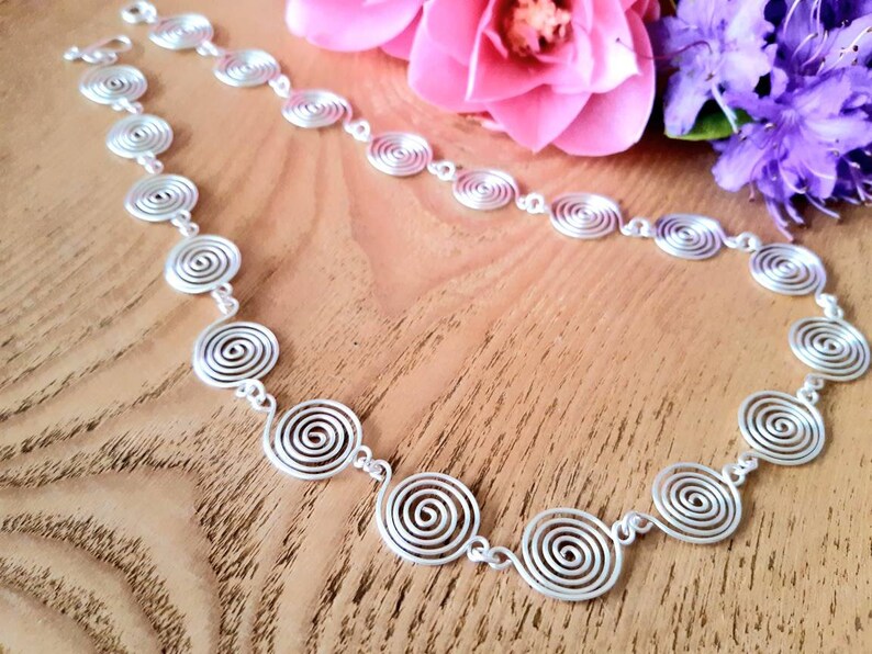 Silver spiral necklace, bracelet and earrings set in our open spiral design. Choose your silver grade - silver plate, sterling silver of fine silver. Choose your length and clasp type.
