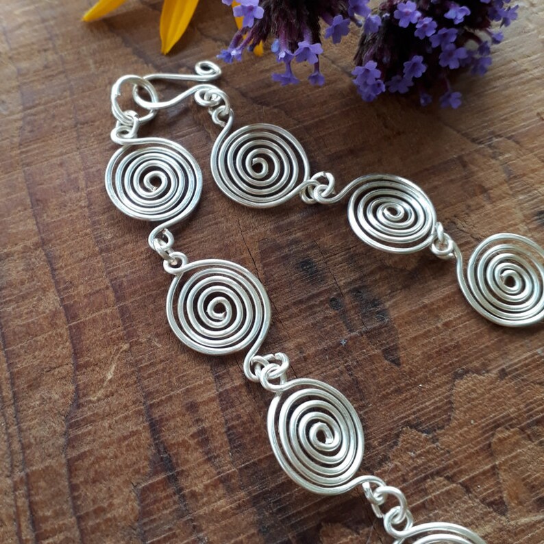 Silver spiral necklace, bracelet and earrings set in our open spiral design. Choose your silver grade - silver plate, sterling silver of fine silver. Choose your length and clasp type.