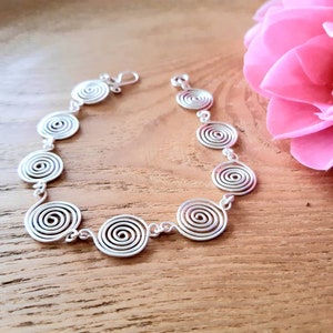 Silver spiral necklace, bracelet and earrings set in our open spiral design. Choose your silver grade - silver plate, sterling silver of fine silver. Choose your length and clasp type.