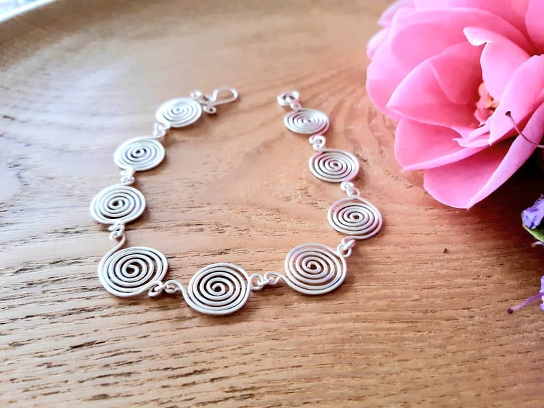 Silver spiral necklace, bracelet and earrings set in our open spiral design. Choose your silver grade - silver plate, sterling silver of fine silver. Choose your length and clasp type.