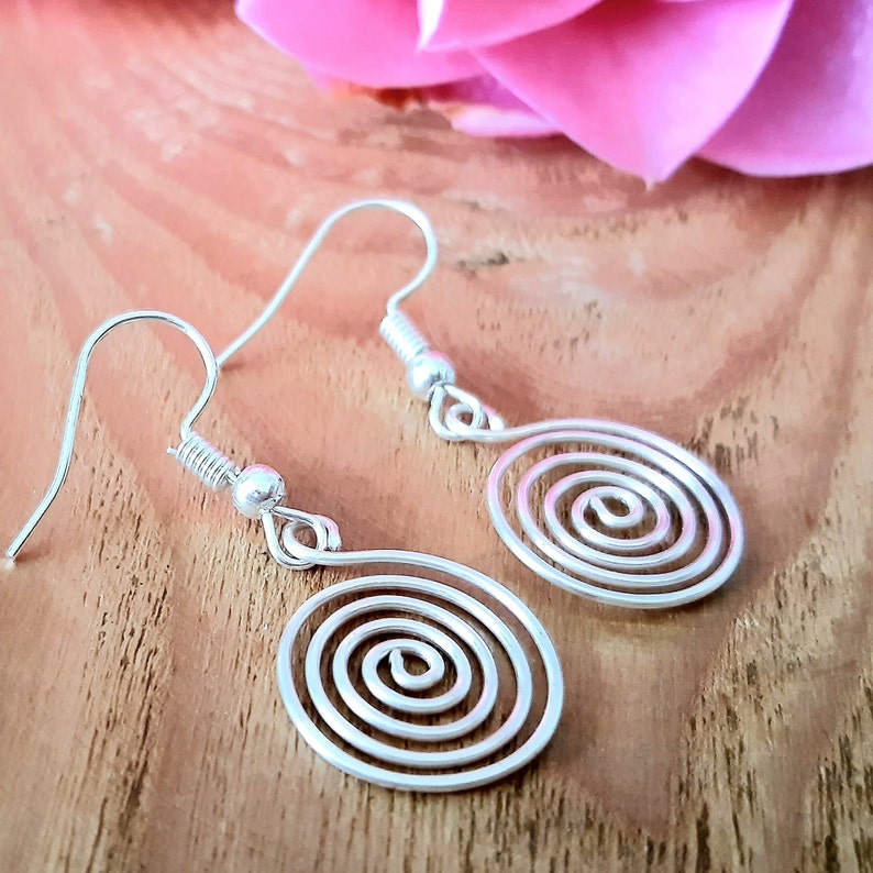 Silver spiral earrings in our open spiral design. Made in a choice of silver grades - silver plate, sterling silver or fine silver.