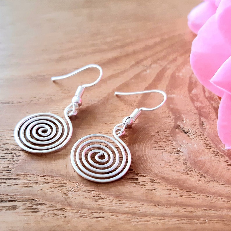 Silver spiral earrings in our open spiral design. Made in a choice of silver grades - silver plate, sterling silver or fine silver.