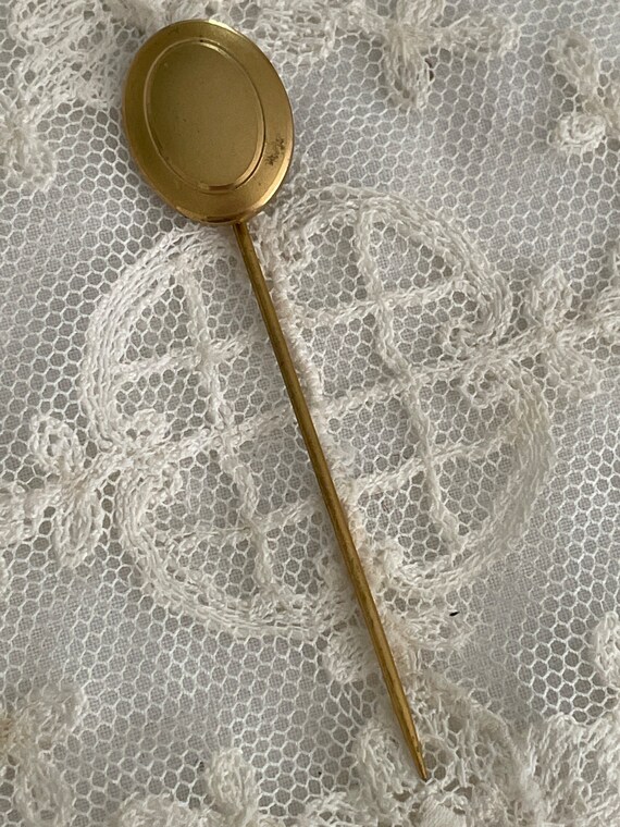 Antique gold plated oval stick pin