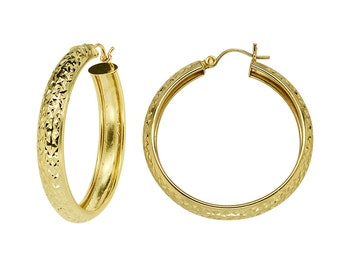 May include: A pair of gold hoop earrings with a textured diamond pattern.