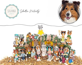 May include: A collection of Sheltie Nativity figurines, featuring various dogs dressed in festive attire. The scene includes a wooden stable, a star, and hay. The image also includes a Sheltie dog portrait and the text "Savanna Shops".