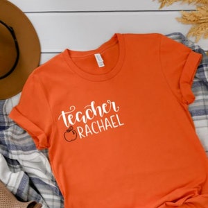 Teacher Shirt In English And Chinese (Available In Orange) Teacher Shirt In English And Chinese (Available In Orange)