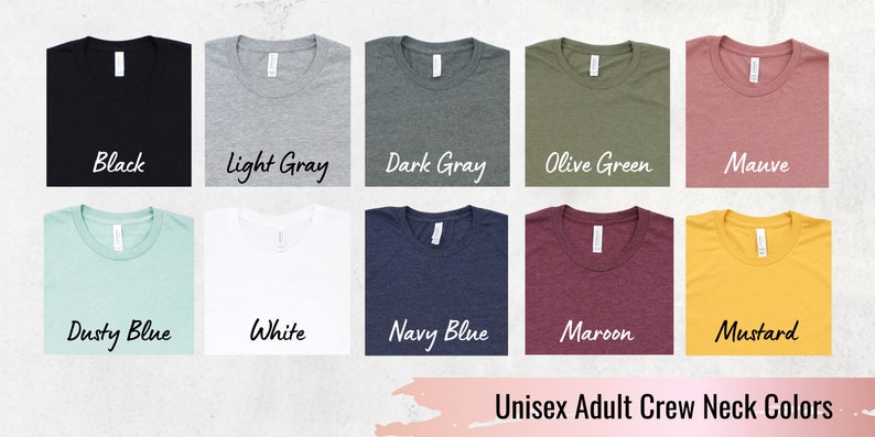 May include: A selection of unisex adult crew neck t-shirts in various colors, including black, light gray, dark gray, olive green, mauve, dusty blue, white, navy blue, maroon, and mustard.  Unisex Adult Crew Neck Colors.