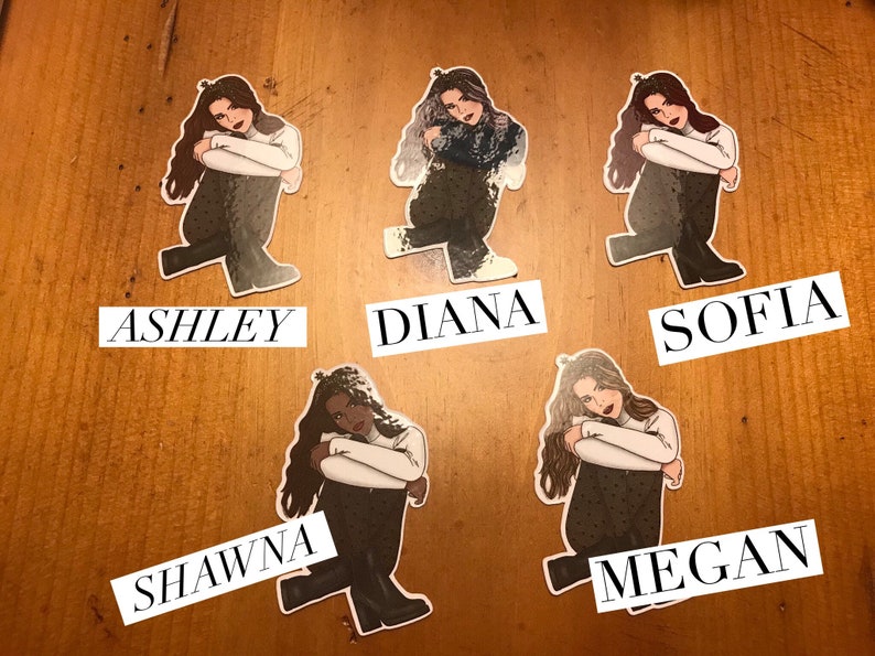 May include: Five illustrated stickers of women with different hairstyles and clothing. Each sticker has a name below it: Ashley, Diana, Sofia, Shawna, and Megan.